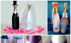Dekoration av champagneflaskor för ett bröllop i form av ett brudpar